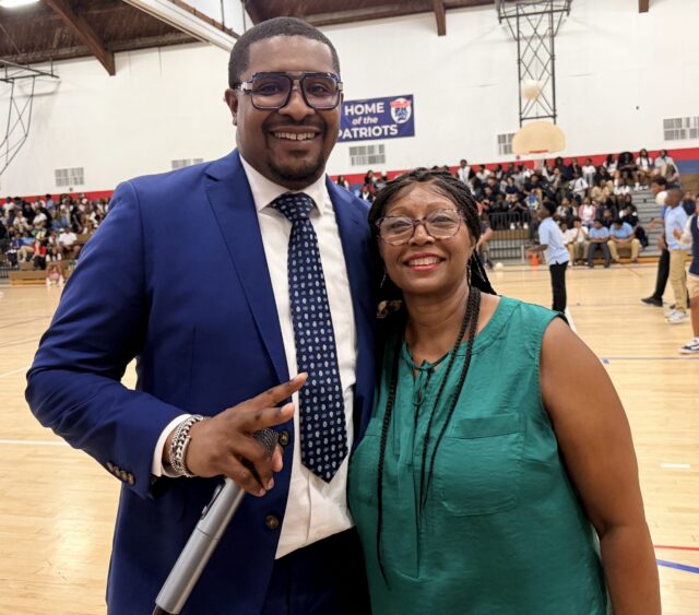 Two smiling PWSD employees.