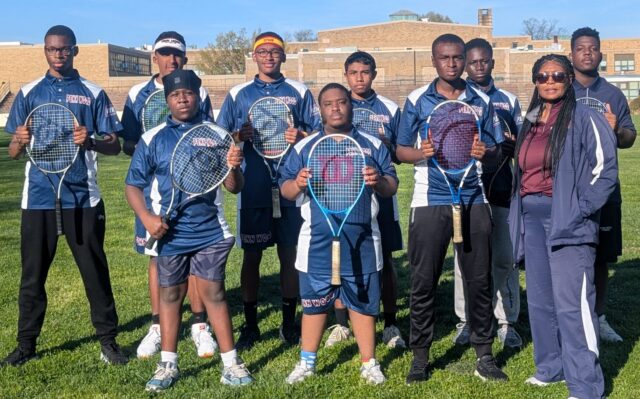 Group photo of the Penn Wood High School boys tennis team and their coach.